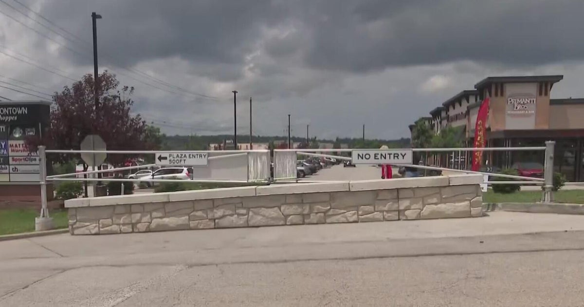 Feud brewing after church closes entry to plaza from private driveway 