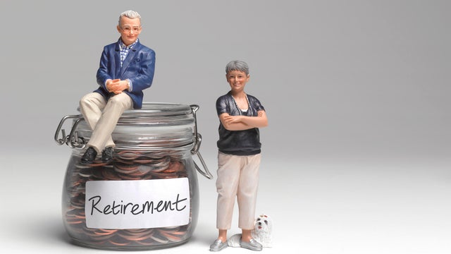 Retired couple with retirement savings jar 