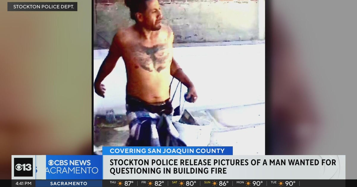 Stockton police release photos of man wanted for questioning in building fire