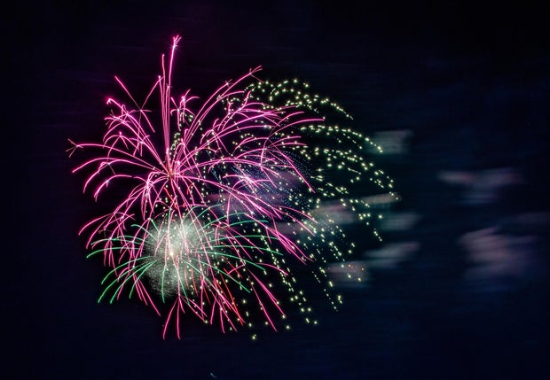 Fireworks, celebrating USA Independence Day, July 4 in Colorado under the edge of Pikes Peak forest 