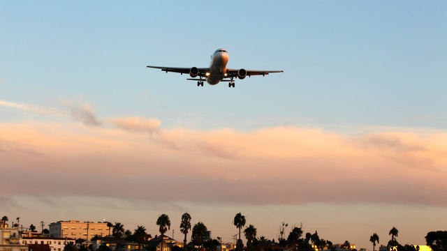 An airplane approaches an airport in San Diego, California.