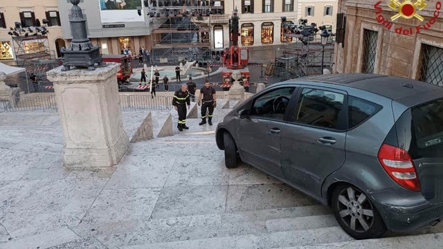 An image made available June 19, 2025, by the Italian firefighters shows a car that was driven by mistake by a man down the Spanish Steps in Rome early on June 17, 2025. 