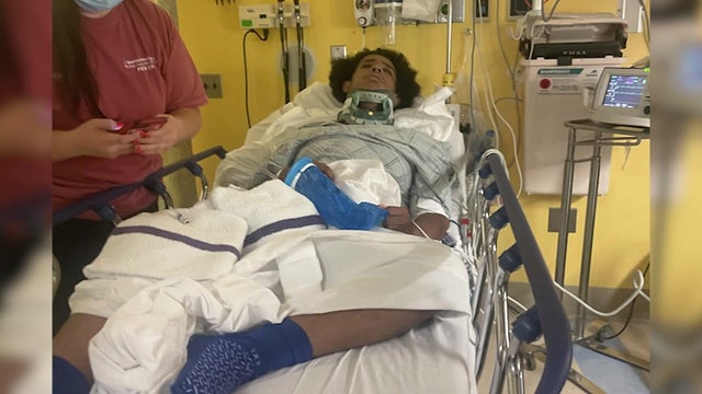 Yassin Khalifa in a hospital bed 