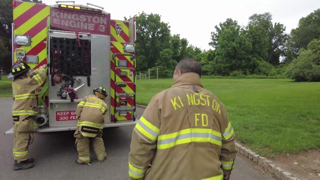Three volunteer firefighters with the Kingston Volunteer Fire Company No. 1. 