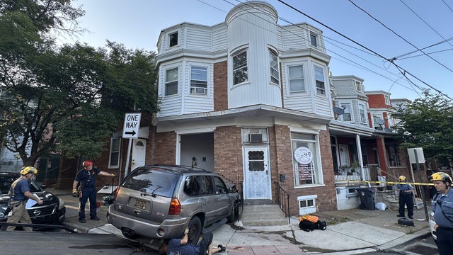 A tan SUV has crashed into a corner building in Wilmington, Delaware, police are on the scene 