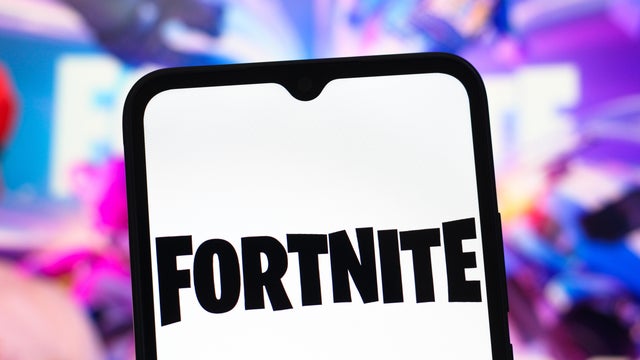 In this photo illustration, the Fortnite logo is seen 