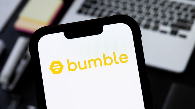 In this photo illustration, a Bumble logo seen displayed on 