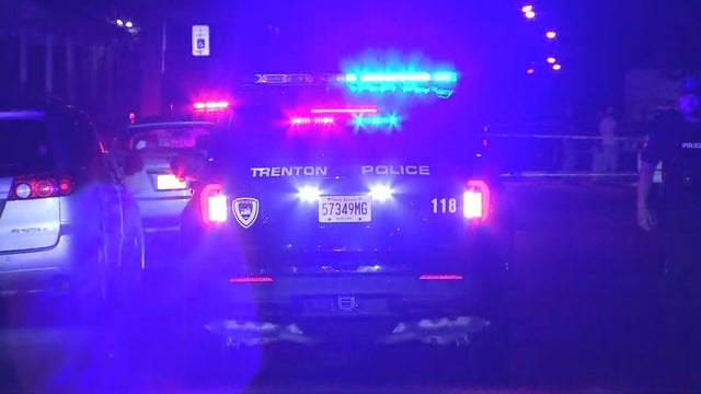 Generic police lights and yellow police tape at crime scene 