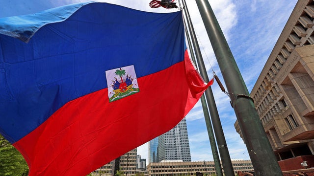A speaker addresses the crowd during a Haitian Flag Raising Ceremony in Boston on May 17, 2024. 