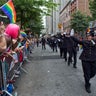 In this June 30, 2013 file photo, members of the Gay Officers Action League of the New York police department are cheered during the gay pride march in New York. 