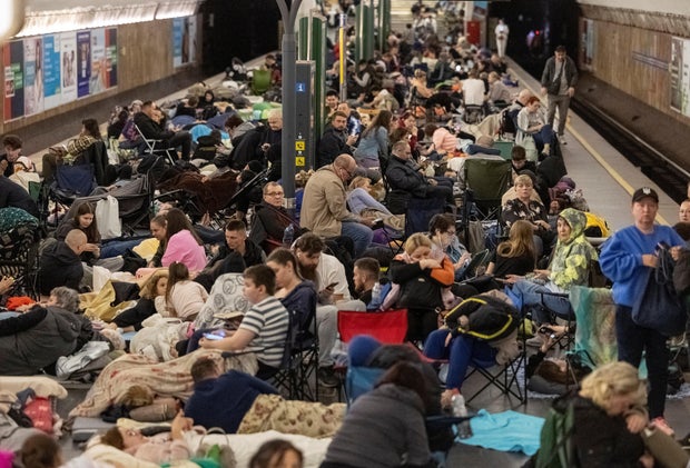 People take shelter inside a metro station during a Russian military strike in Kyiv 