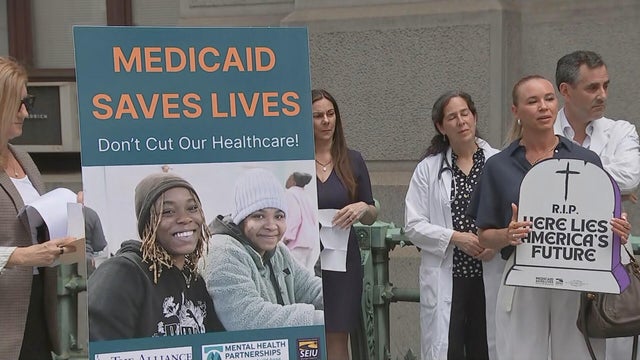 A sign says Medicaid saves lives at the press conference calling for lawmakers to vote against cuts to Medicaid 