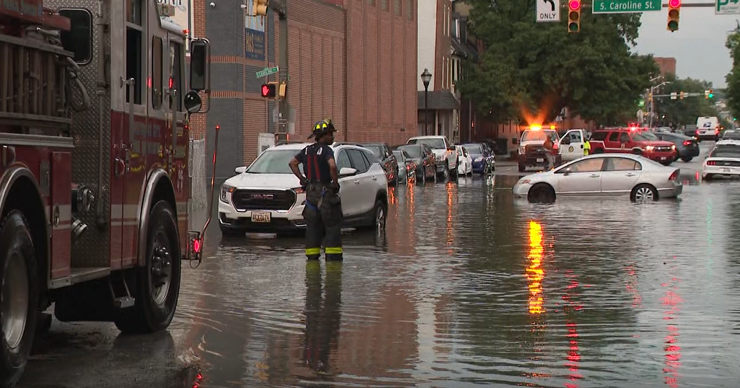 Baltimore's Fells Point streets flood as several cars stall in the rising water 