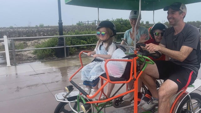 A family rides in a multi-person bicycle on the promenade in Sea Isle City, New Jersey 