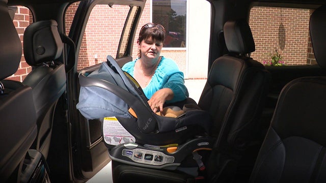 Maryland nurse shows parents how to install car seats 