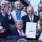 Trump signs "big, beautiful bill" as tariff deadline looms
