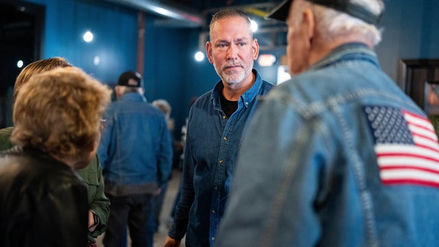 Independent Senate candidate Dan Osborn chats with attendees after speaking during his campaign stop at the Handlebend coffeshop in O'Neill, Neb., on October 14, 2024. 