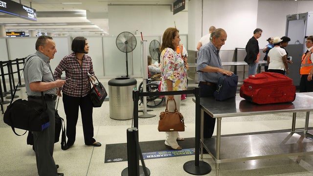 Transportation Security Administration Officials Demonstrates Time Saving Travel Tips At Miami Airport 