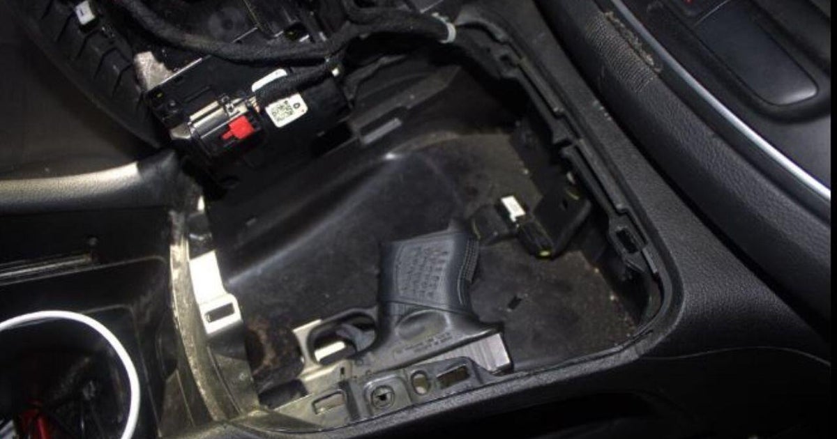 Shelby Township police notice hidden compartment in car, find concealed pistol 