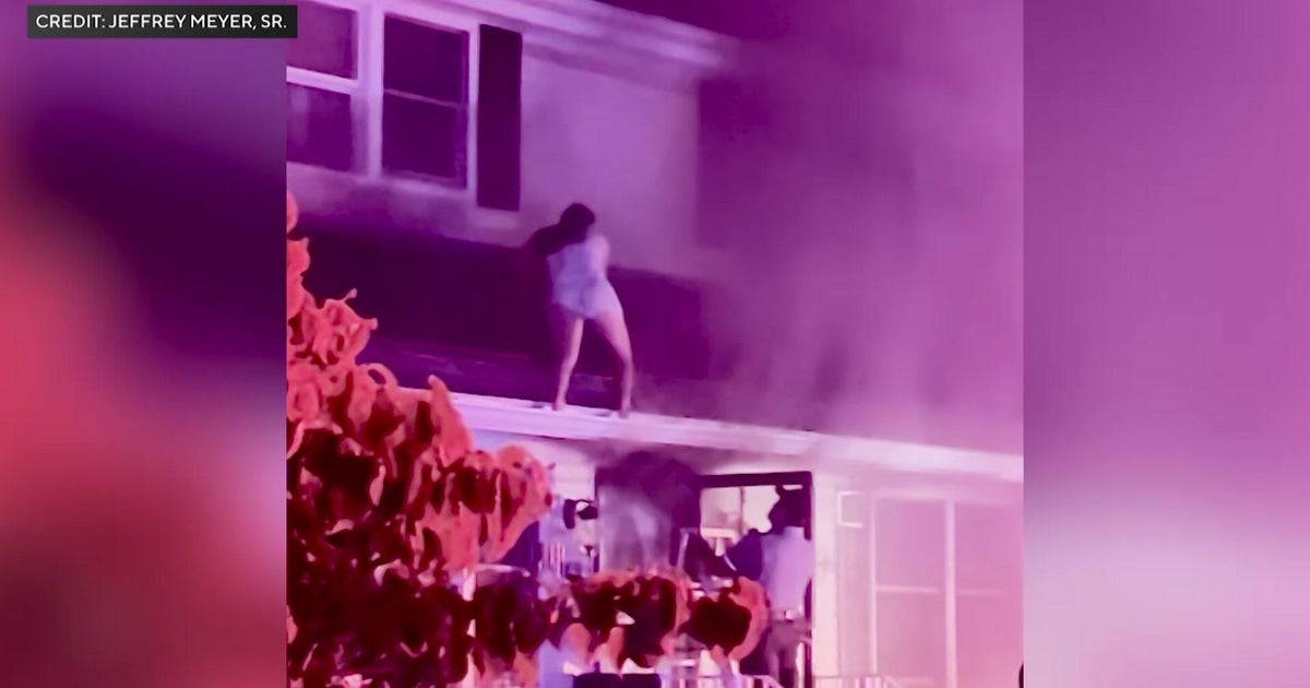 Woman rescued from roof after saving everyone from burning N.J. home 