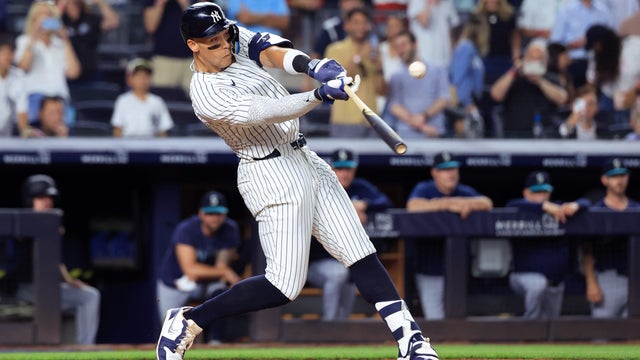 Aaron Judge #99 of the New York Yankees hits a walk-off sacrifice fly ball during the tenth inning against the Seattle Mariners at Yankee Stadium on July 10, 2025 in New York City. 