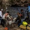 Rescuers in Texas painstakingly pick through debris after deadly flooding
