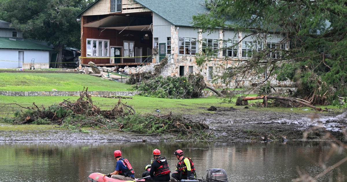 Emergency official says he was sick and asleep when deadly floods hit 