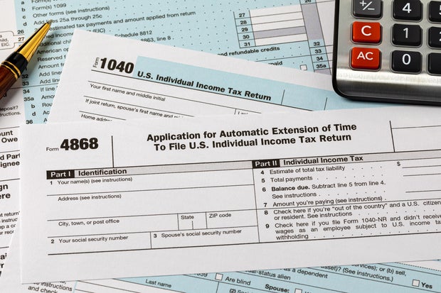 Form 4868 automatic filing extension for federal income taxes. Income tax return filing deadline, delay and penalty concept. 