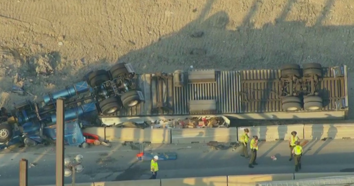 Driver dies after semi truck hauling cheese rolls over on I-294 ramp 