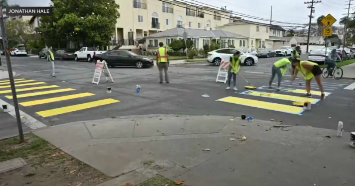 West LA neighbors fed up with dangerous driving paint their own crosswalks around popular park 