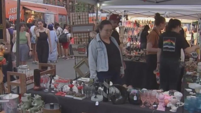 People browse a vendor's table at the Northern Liberties Night Market in a prior year 