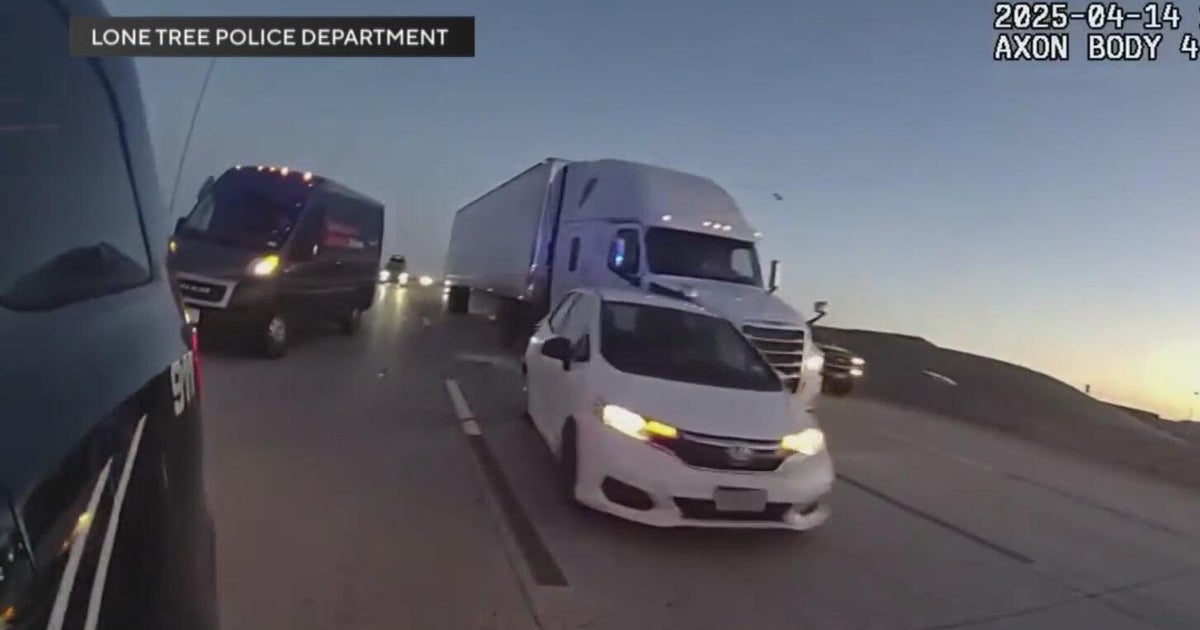 Colorado police officer's body camera shows close call on I-25 
