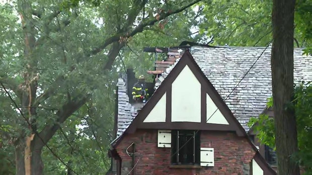 A hole can be seen in the roof of a home in Plainfield, New Jersey. 