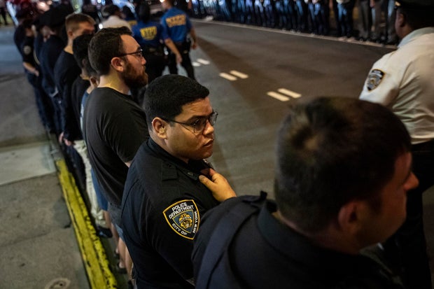 Chaotic scene in Midtown Manhattan after shots ring out in office tower, killing 4 including police officer