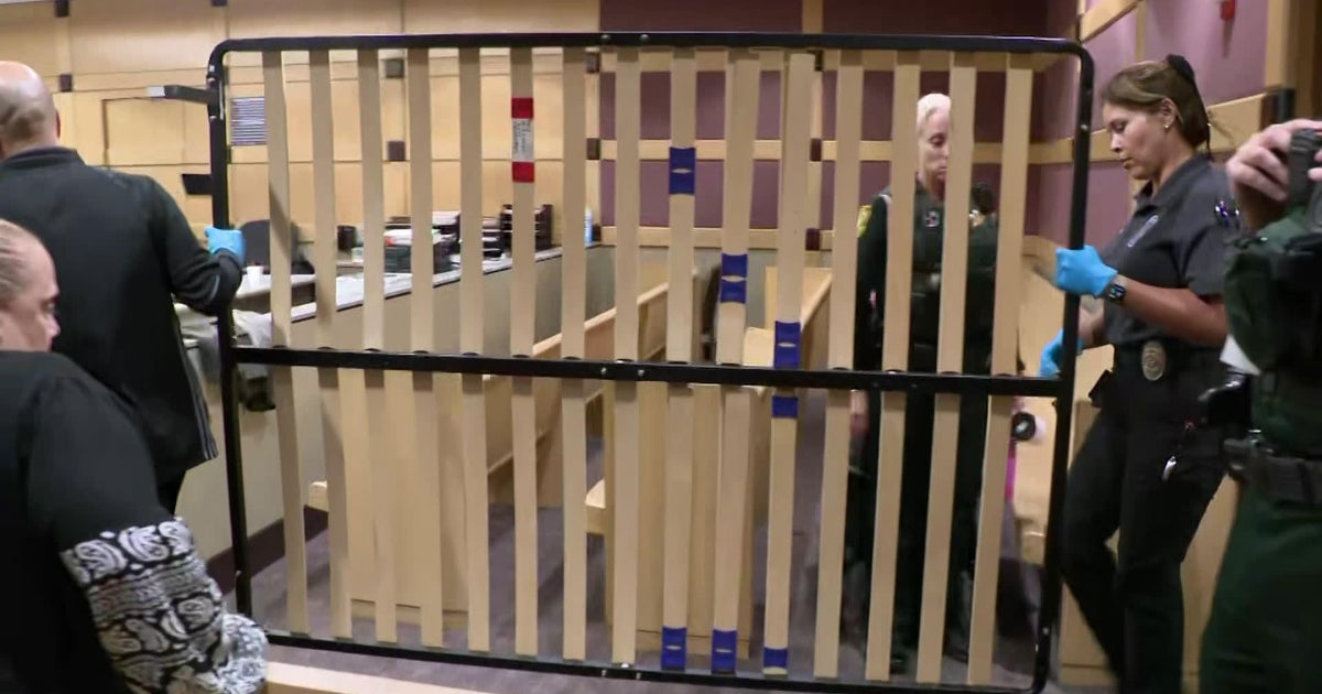 Prosecutors reconstruct crime scene with bed in Broward courtroom during spear murder trial 