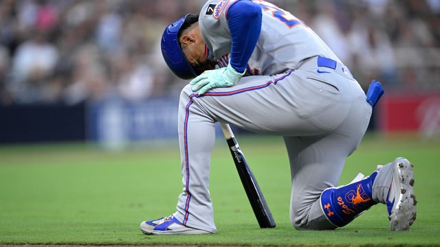 Juan Soto #22 of the New York Mets reacts after being hit by a foul ball during the fourth inning against the San Diego Padres at Petco Park on July 29, 2025 in San Diego, California. 