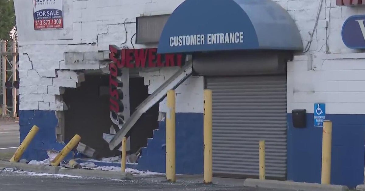 Two dead, two others injured, after vehicle strikes furniture building 