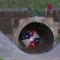 Boy swept away by floods into storm drain, officials say