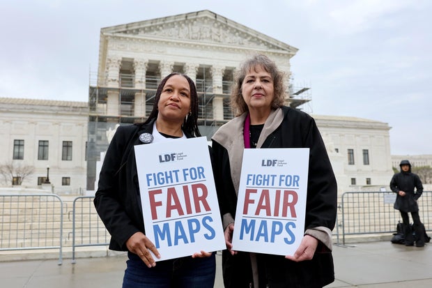 Kesha Moore and Anne Houghtaling call on the Supreme Court to uphold a fair congressional map in Louisiana v. Callais in Washington, D.C., on March 24, 2025.