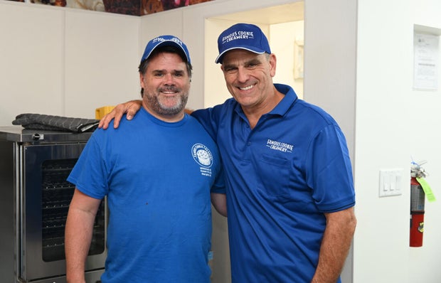 Two people post for a photo at the event