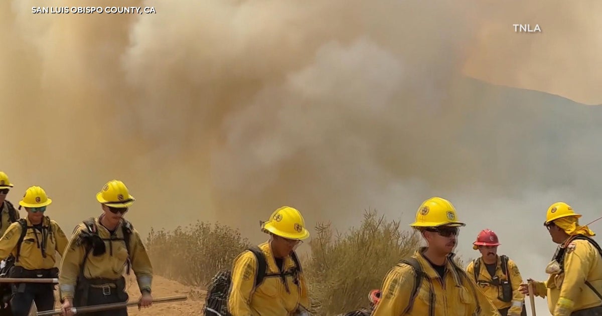 Crews rush to contain raging wildfires forcing evacuations in western states