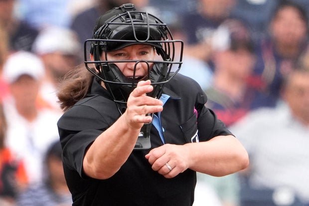 Umpire Jen Pawol calls a strike during sping training 