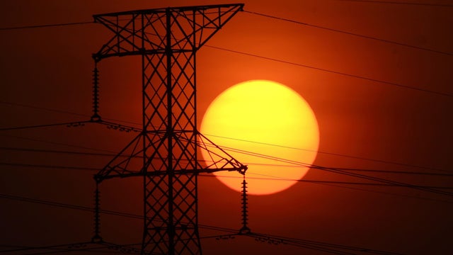 A generic photo of the sun setting behind high voltage powerlines, 23 January 20 