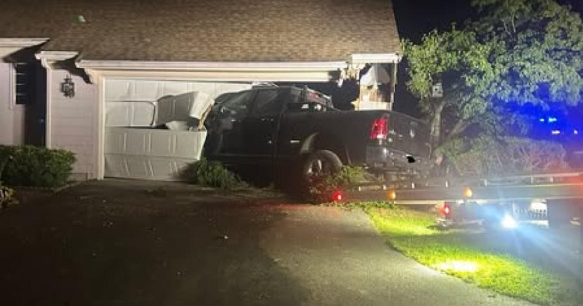 Pickup truck crashes through home's garage door in Pembroke 