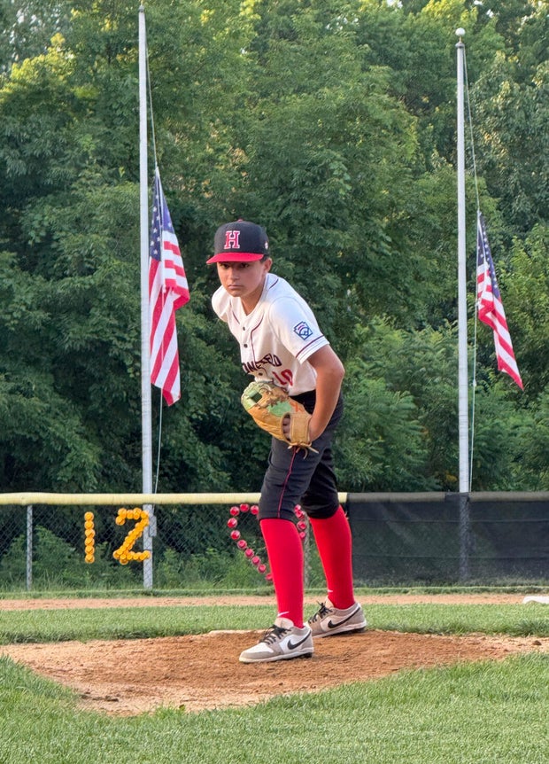 In this undated photo provided by Joseph "Joe" Rocco, his son, Marco Rocco, prepares to deliver a pitch in a baseball game in Haddonfield