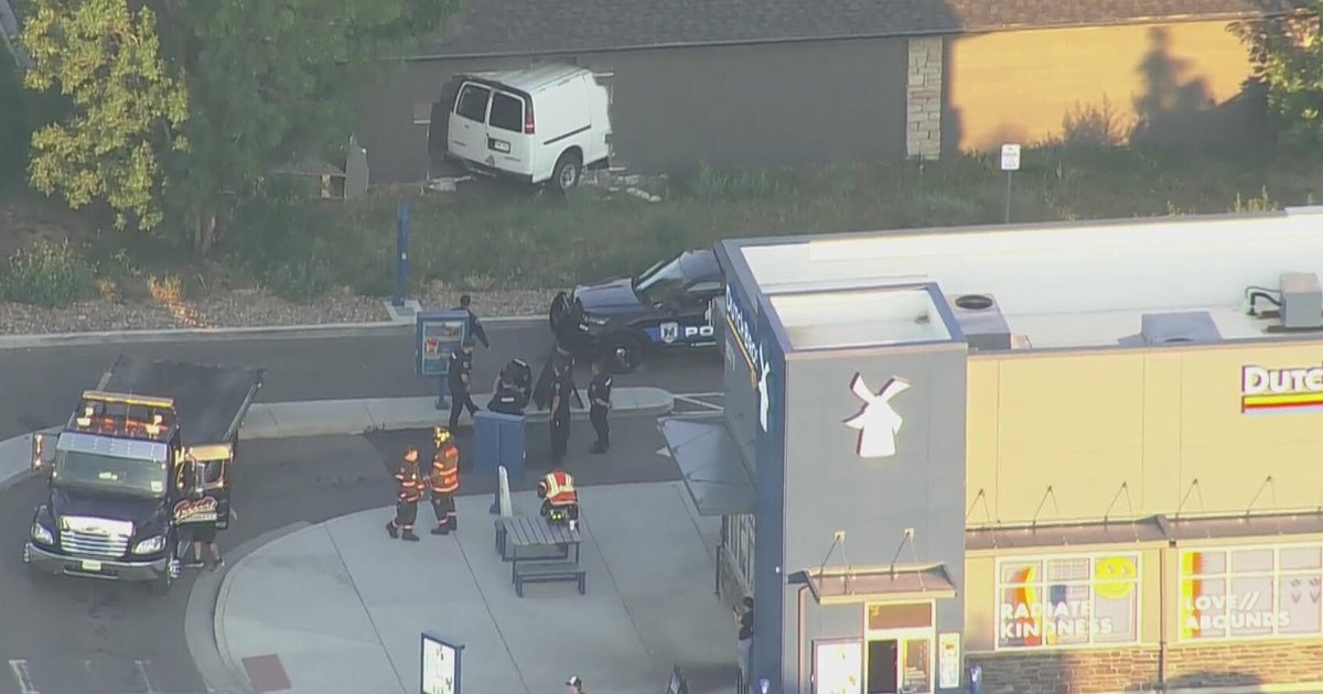Van misses Dutch Bros. drive-thru in Northglenn before crashing into garage 