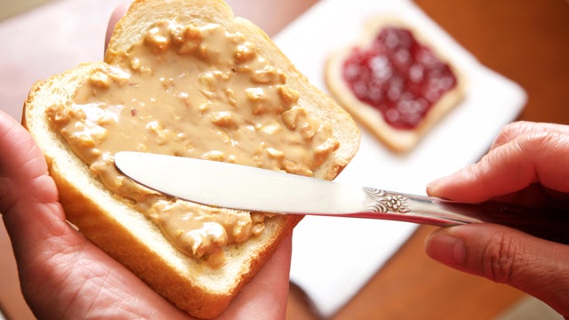 Spreading peanut butter and jelly 