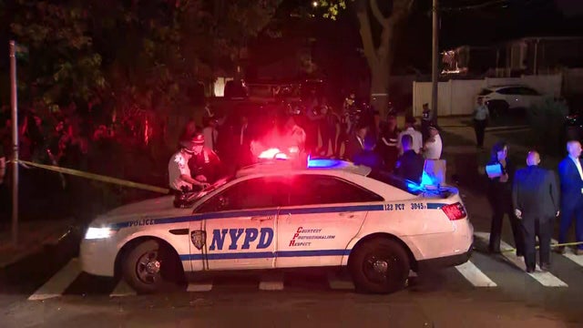 NYPD vehicle and police officers 