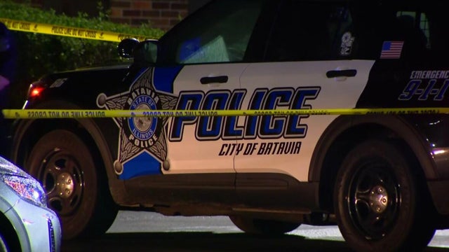 Generic police lights and yellow police tape at crime scene 