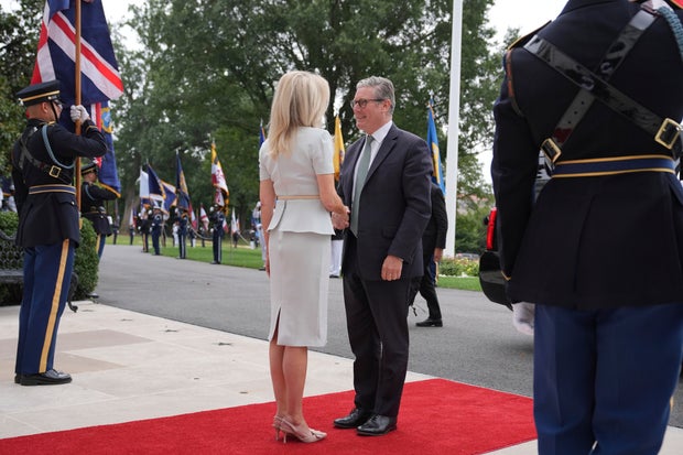 Monica Crowley, chief of protocol, greets British Prime Minister Keir Starmer upon arriving to the White House on Monday, Aug. 18, 2025. 